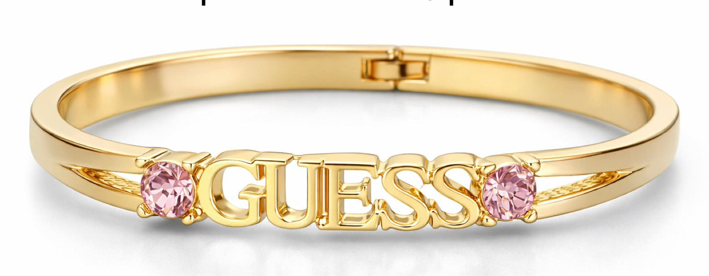 Brazalete  Guess dorada con detalles en rosa