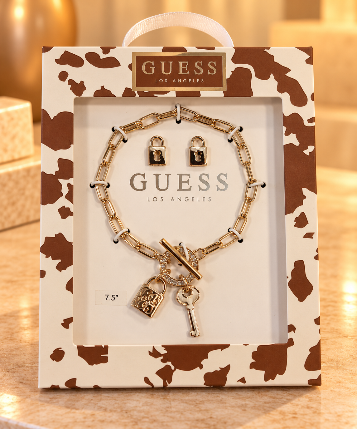 Set Guess pulsera y aretes dorada