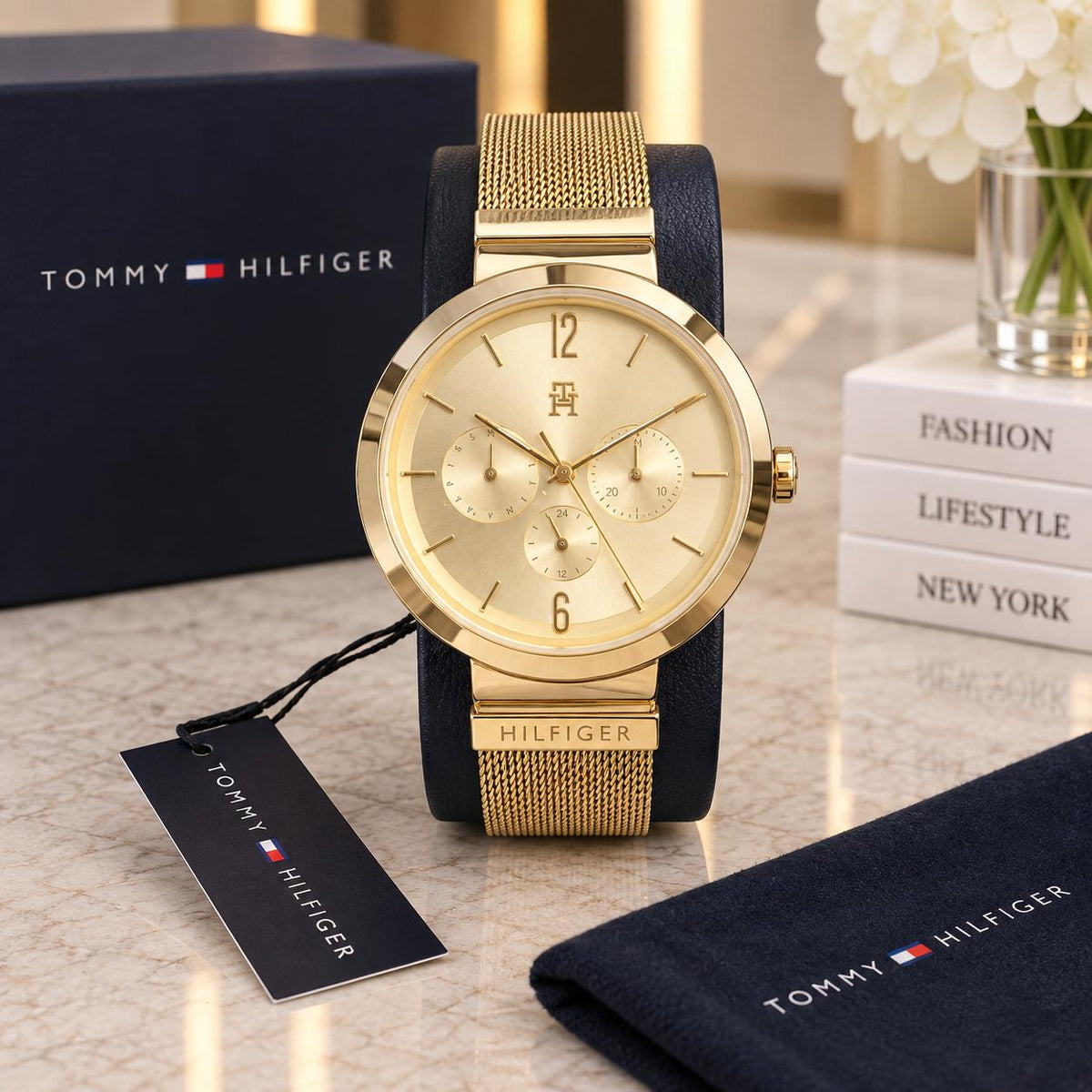 Reloj TH dorado